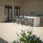 Outdoor kitchen with Jeffrey Court Porcelain pavers and Pool Mosaic on the bar